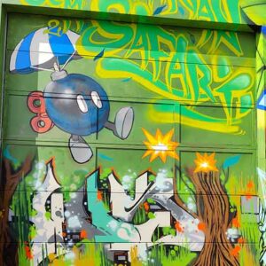 Bavarian Safari Graffiti Jam Landsberg 2023 O-Bomb mit Graffiti darunter und Safari Schriftzug in grün